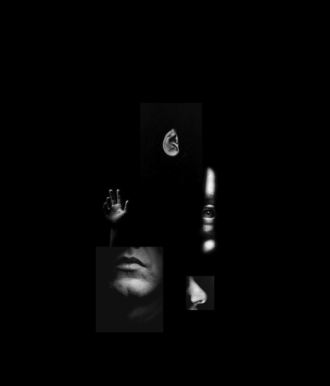 Rostro apenas iluminado en la oscuridad